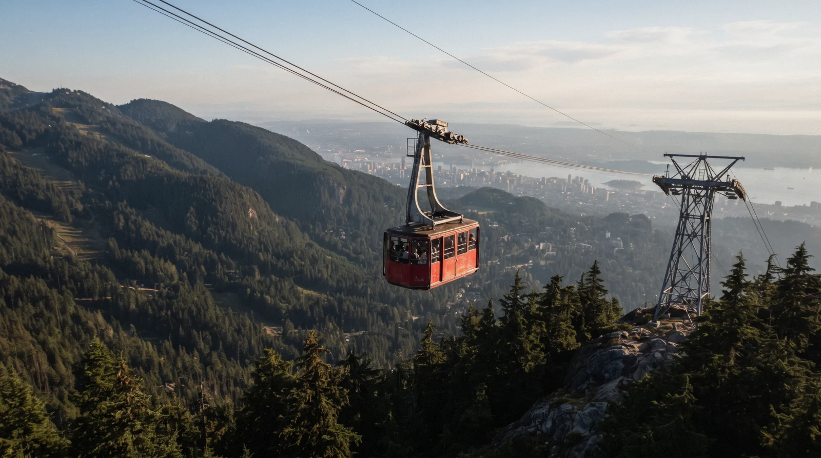 Red Skyride tram climbing above the North Shore forest towards the chalet, Grouse Mountain in North Vancouver